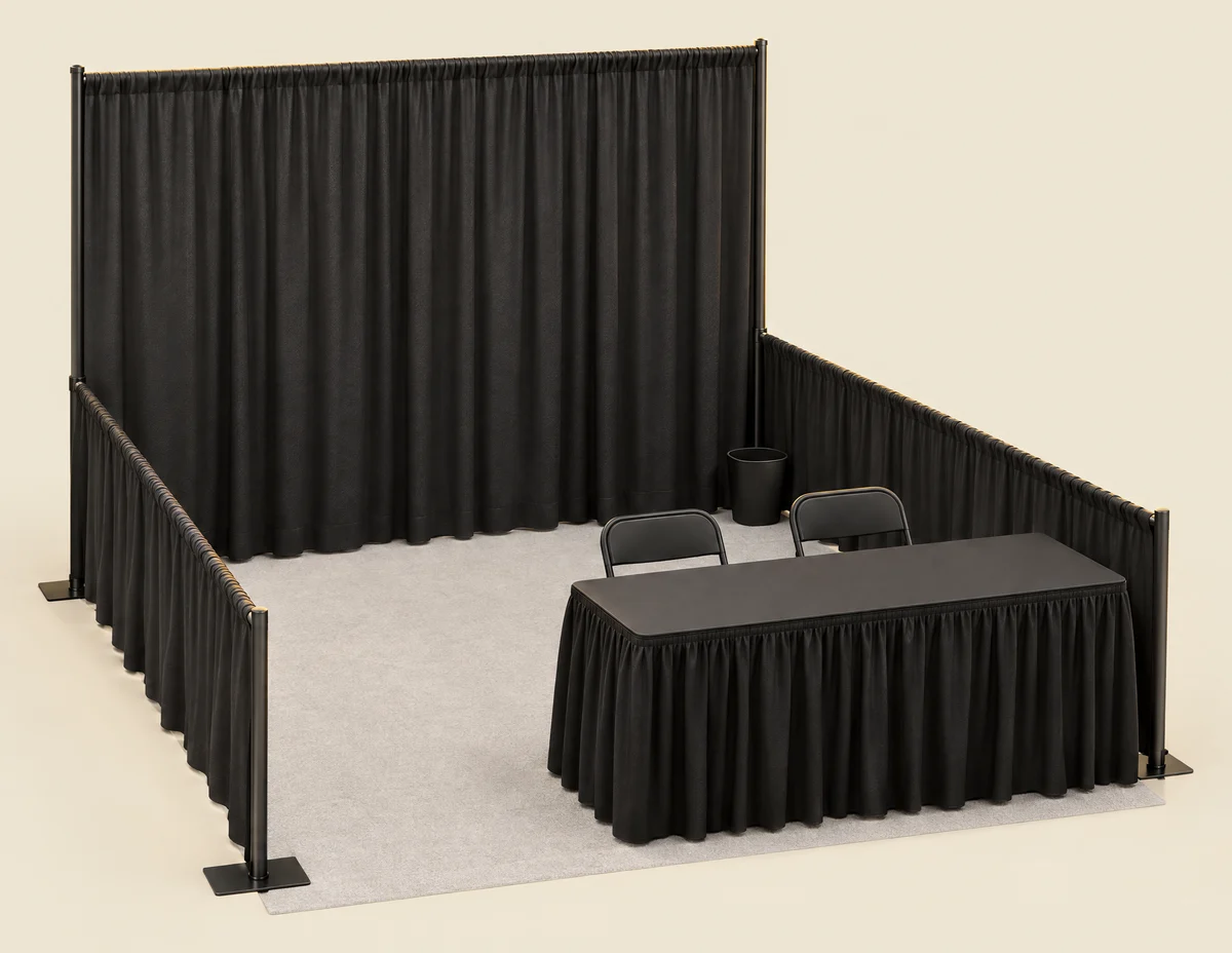 Illustration of a 10 × 10 booth: black backwall and sidewall drape, skirted table, two chairs and a wastebasket